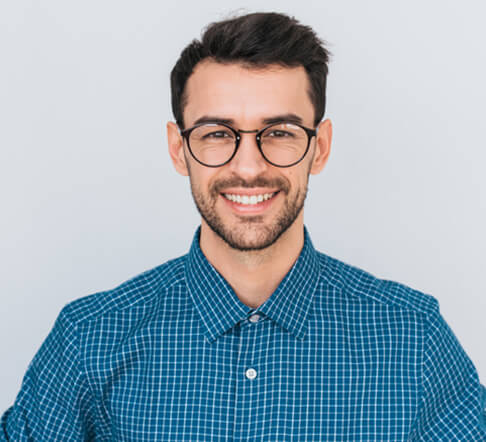 man with glasses smiling