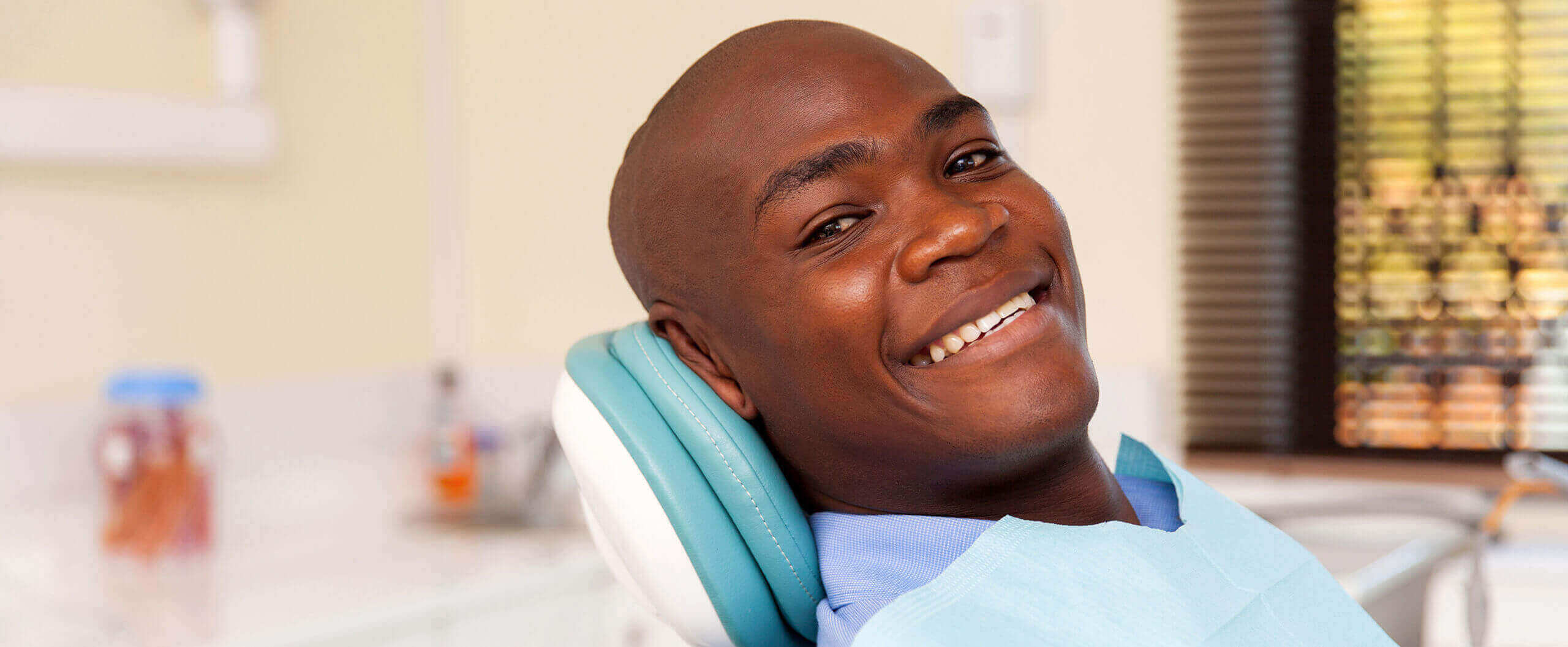 Leesburg Dental Office - smiling man sitting in a dental chair