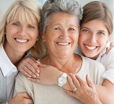 three generations of smiling women